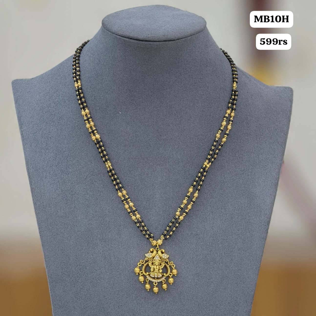Laxmi pendant with 2 lines Short black beads
