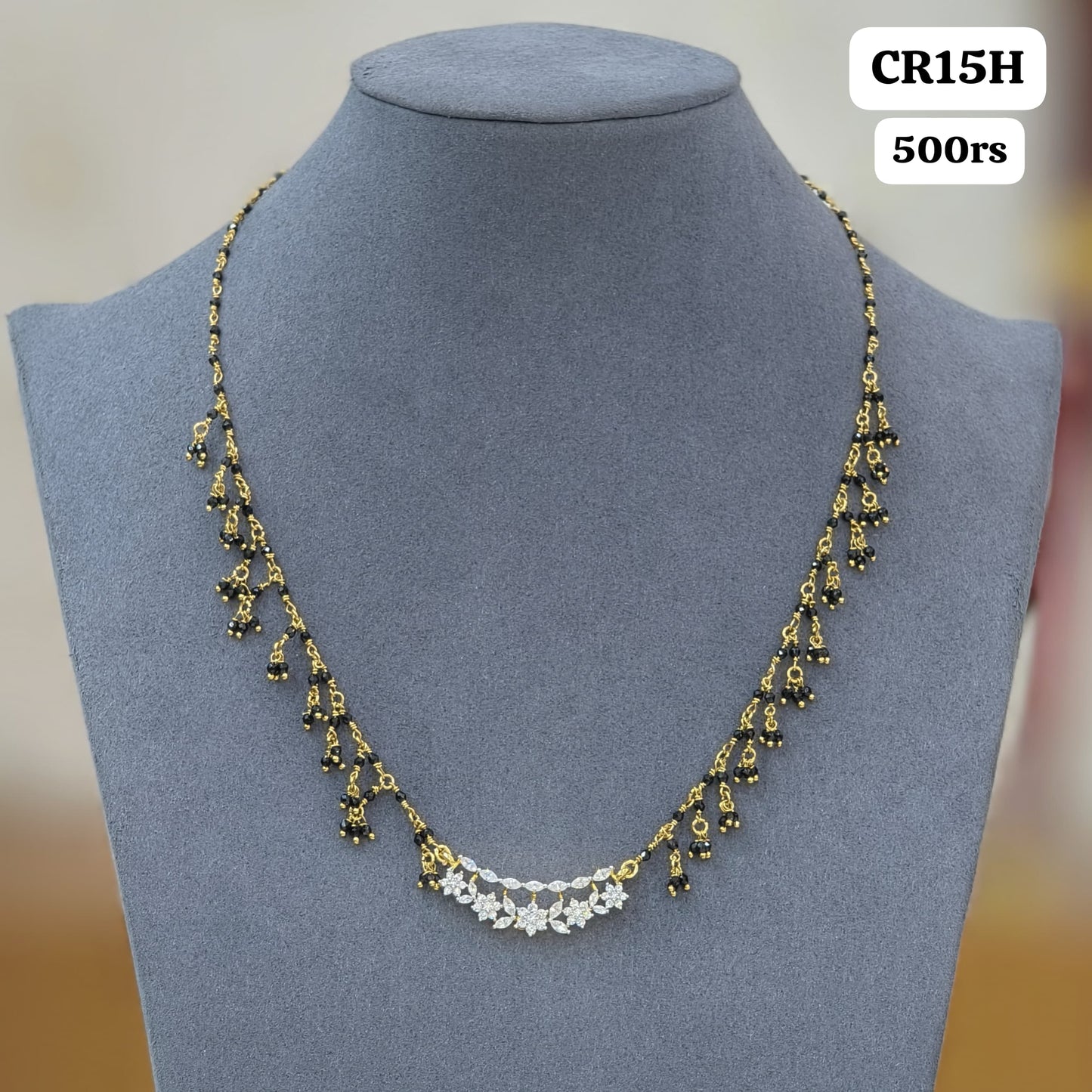 Diamond pendant with black crtyal beads