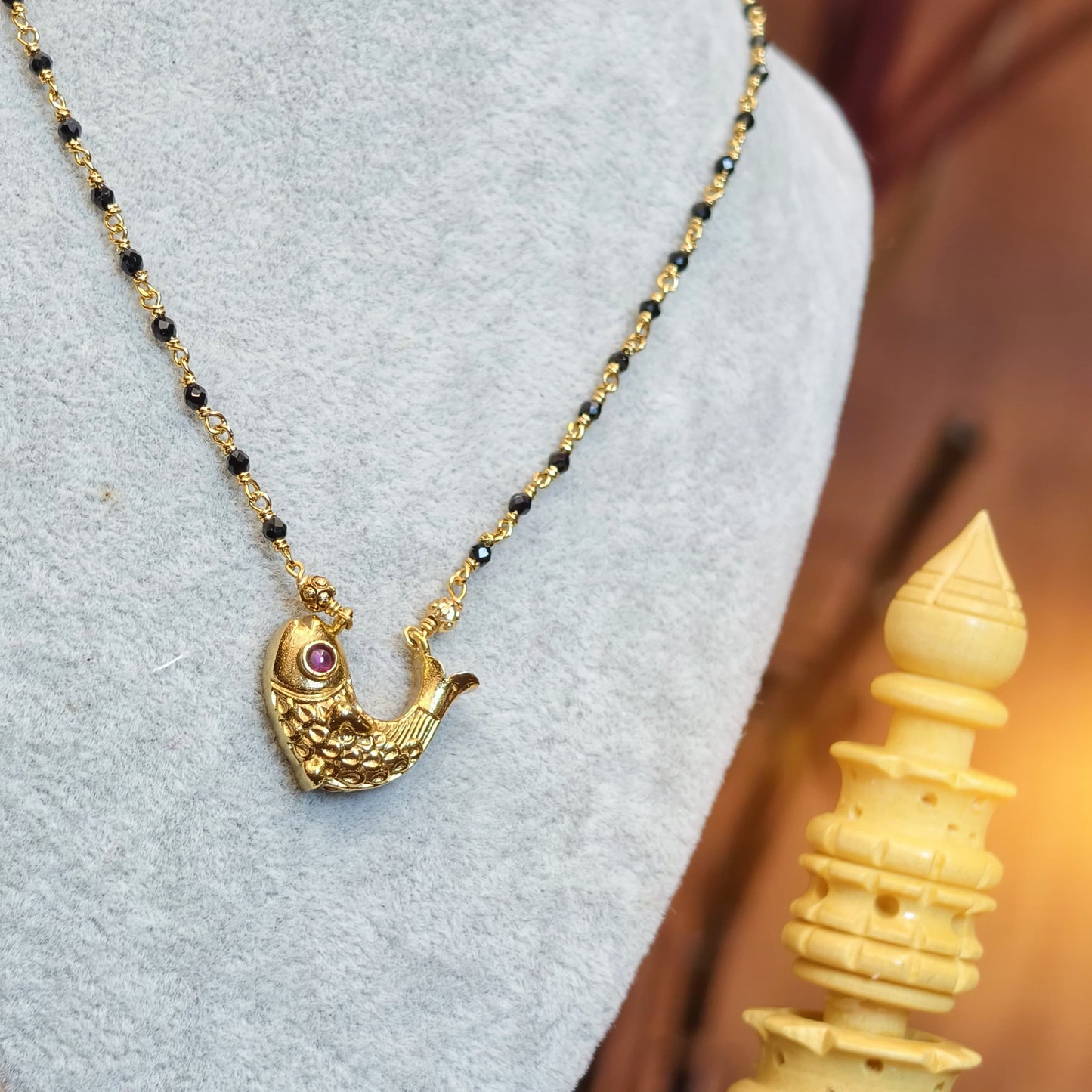 Short black diamonds[ fish pendant ]