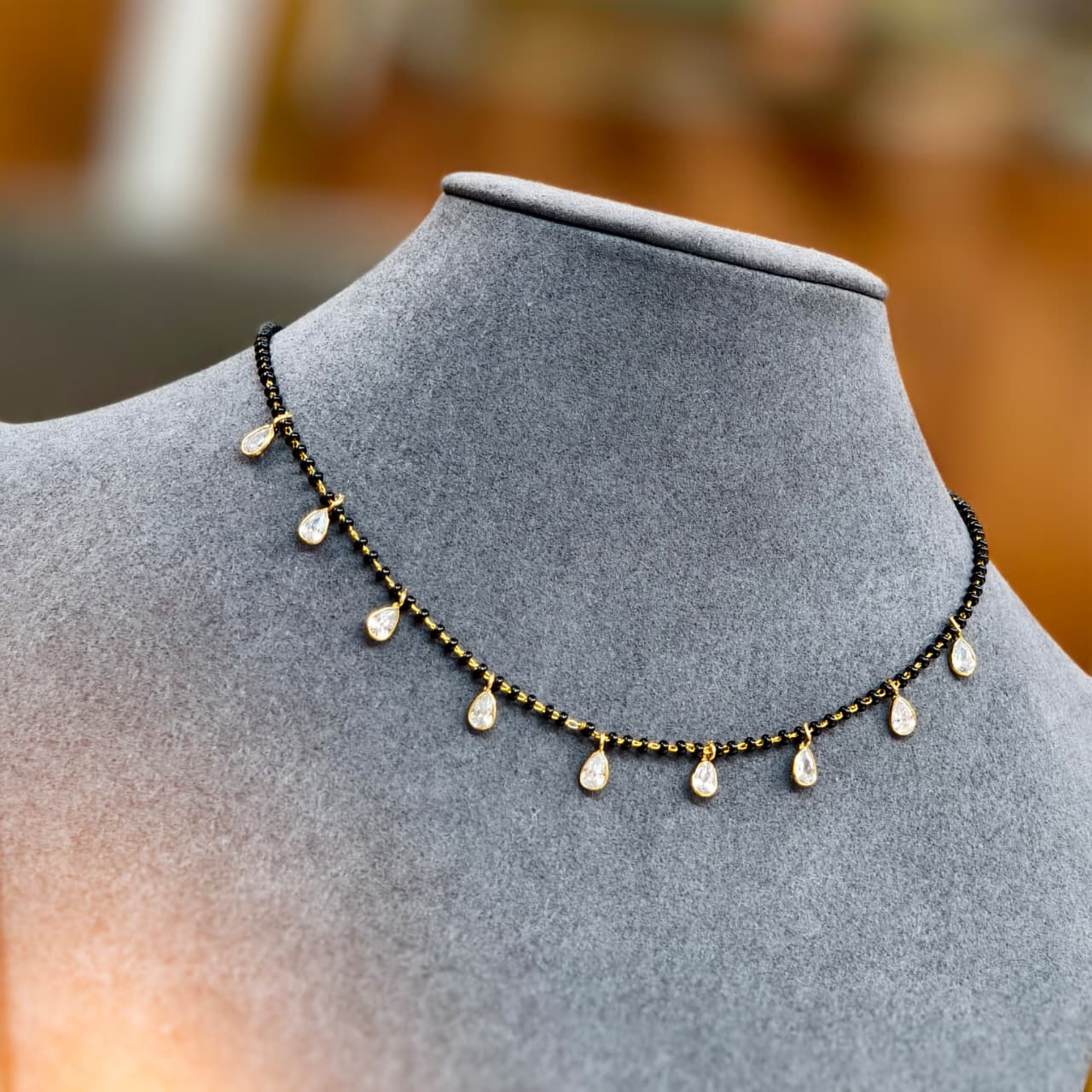 White drop black beads