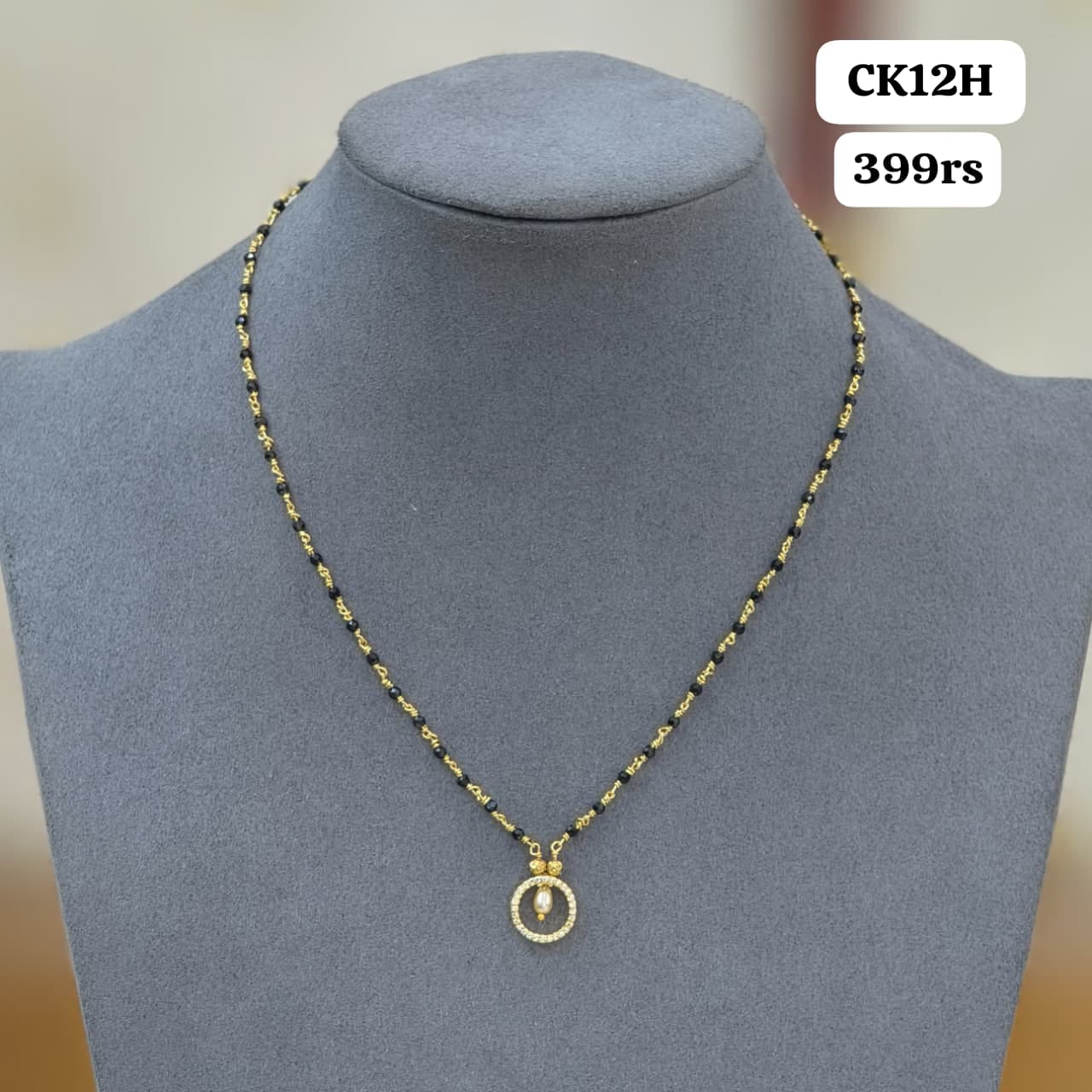 Diamond pendant with Short black beads