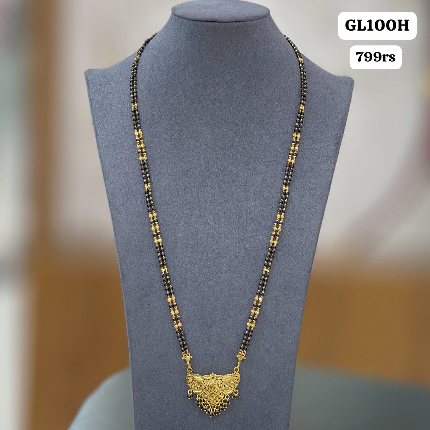 Gold desgin long black beads