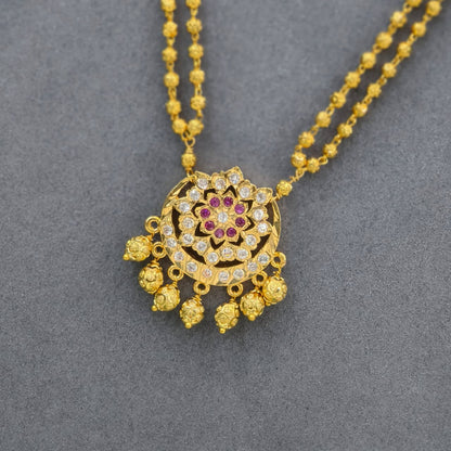 White stone pendant with gold beads & chain
