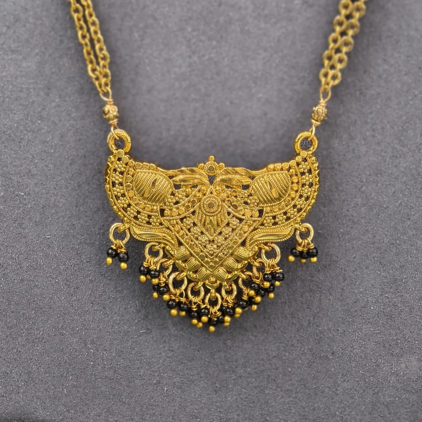 Pendant with Chandraharam & black beads