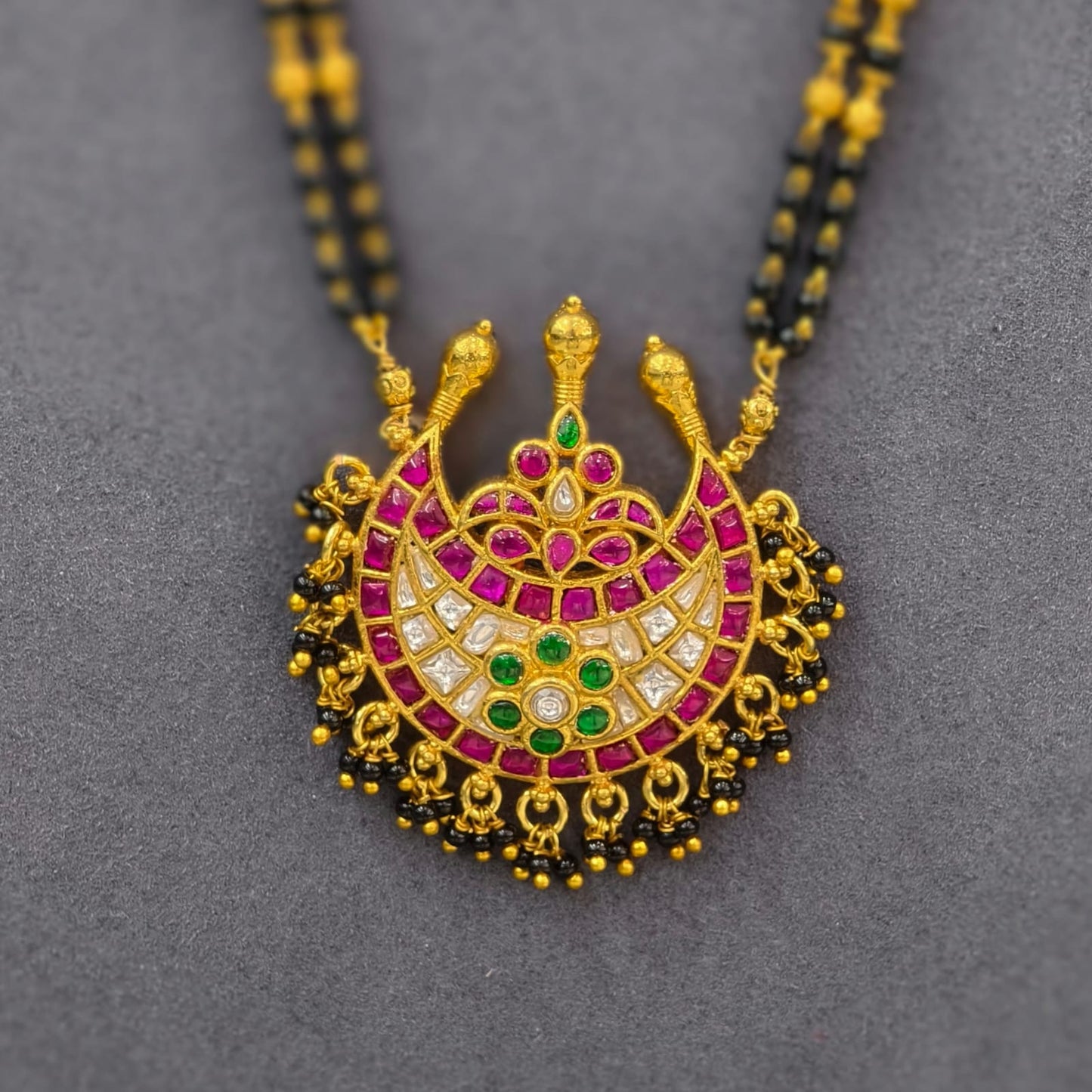 Kundan pendant with black beads