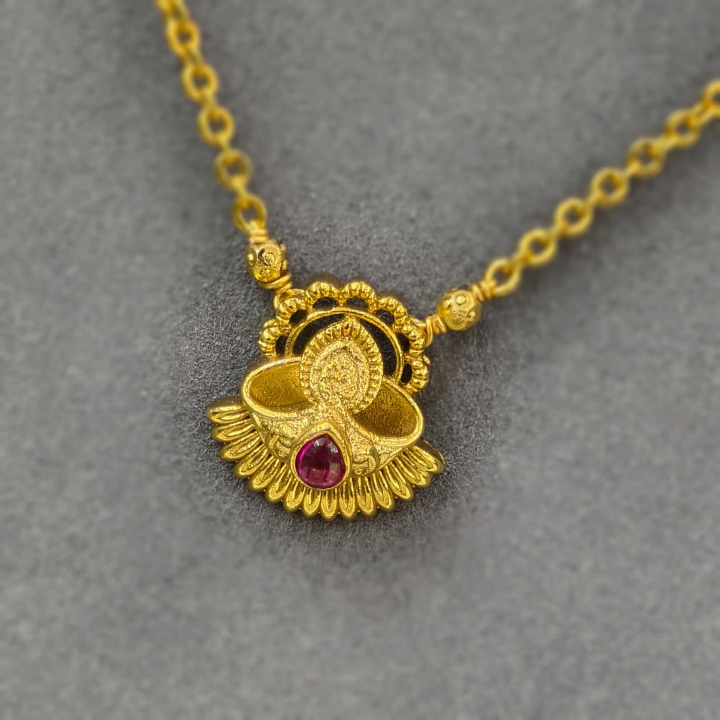 Deepam pendant with short black beads