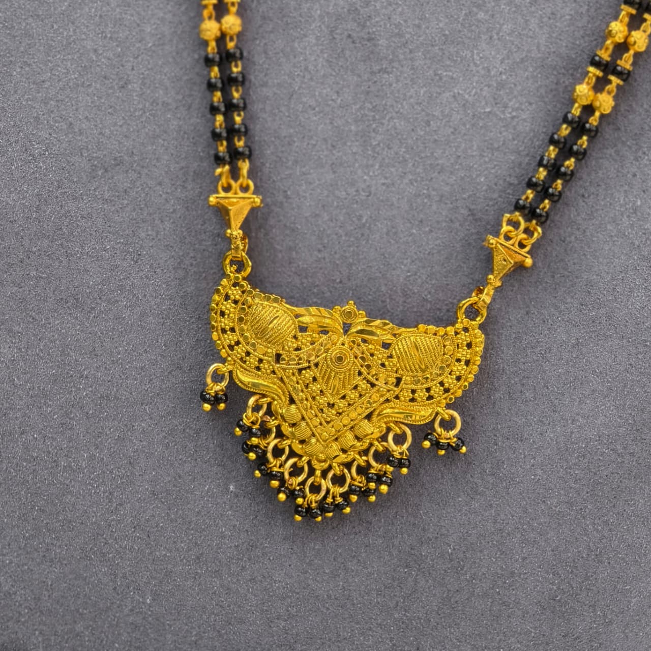 Gold desgin long black beads
